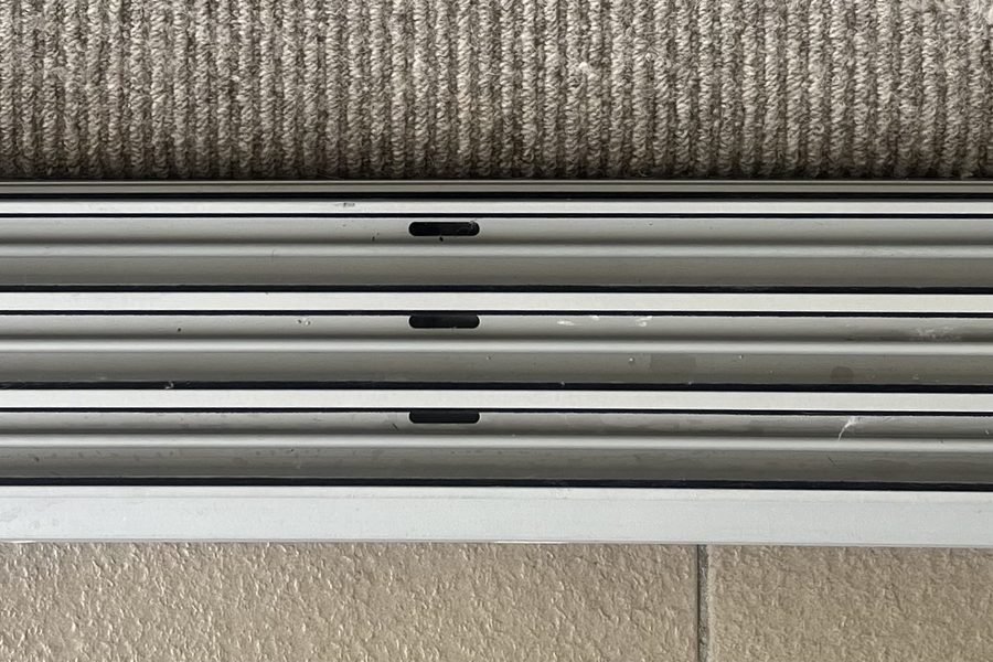 Sliding door track cleaned out, bare aluminium with no grit left in the channels